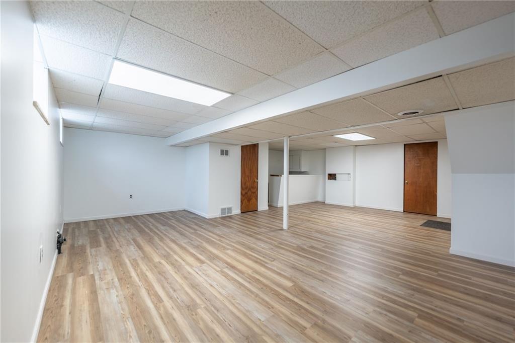 601 Hillcrest Avenue McKees Rocks, PA 15136 - Photo 27 of 32 a view of an empty room with wooden floor