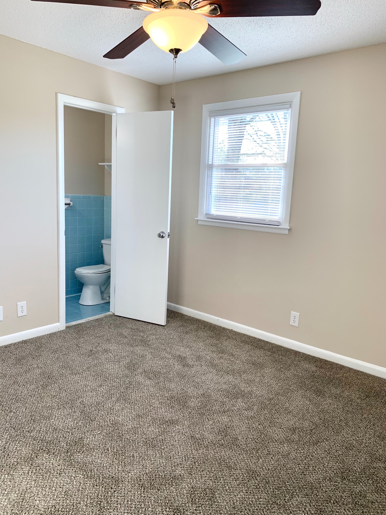 498 Bunker Hill Road Clarksville, TN 37042 - Photo 13 of 20 an empty room with windows and fan
