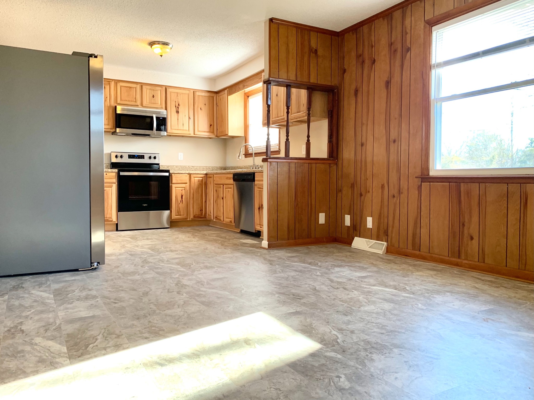 498 Bunker Hill Road Clarksville, TN 37042 - Photo 4 of 20 a view of a kitchen with a sink and a stove