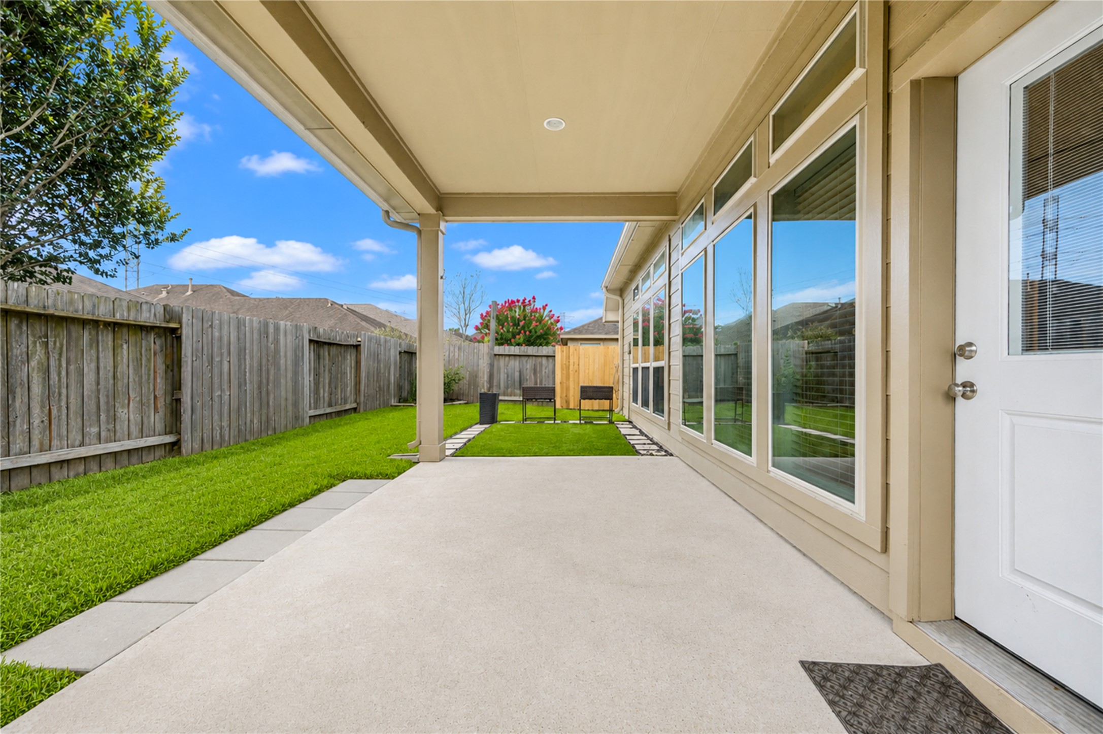 27407 Gatlin Lane Spring, TX 77386 - Photo 33 of 35 The generous covered patio creates the perfect extension of the living space, providing a shaded spot for morning coffee, outdoor dining, or unwinding after a long day.