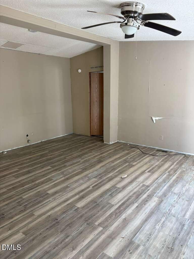 567 Miller Road Benson, NC 27504 - Photo 2 of 8 a view of a room with a ceiling fan