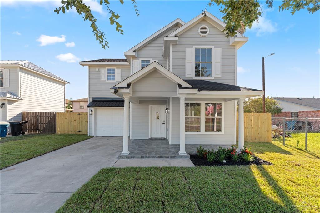 6300 North 21st Street McAllen, TX 78504 - Photo 1 of 19 a front view of a house with garden