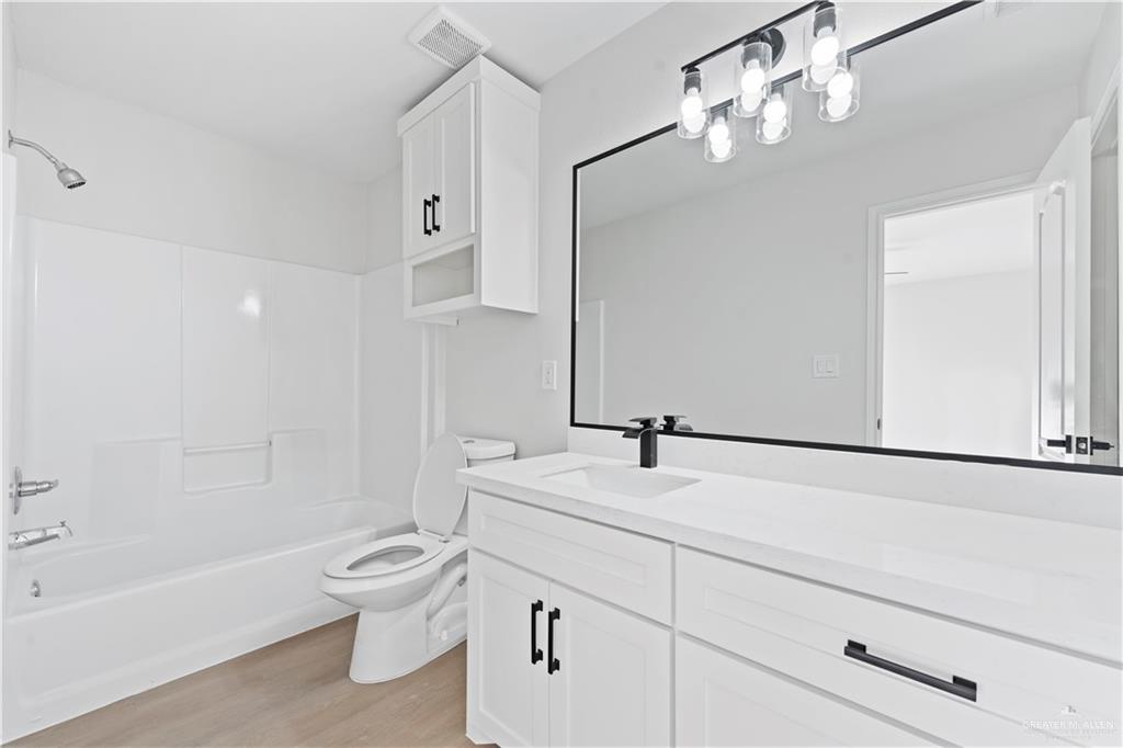 6300 North 21st Street McAllen, TX 78504 - Photo 15 of 19 a bathroom with a sink a toilet and bathtub