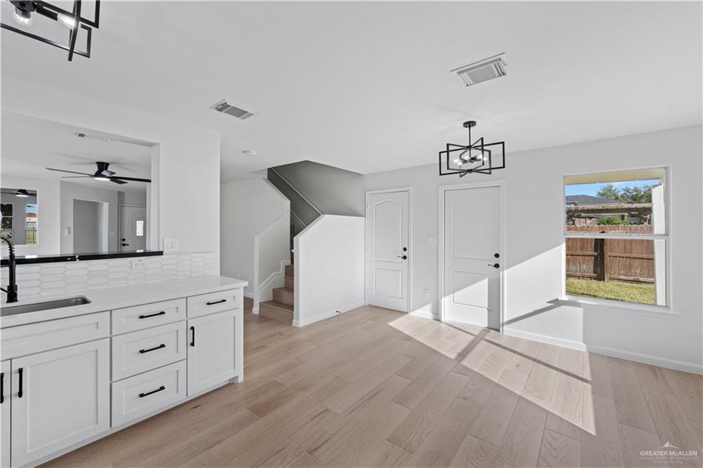 6300 North 21st Street McAllen, TX 78504 - Photo 3 of 19 a spacious bedroom with a bed and a dresser in it