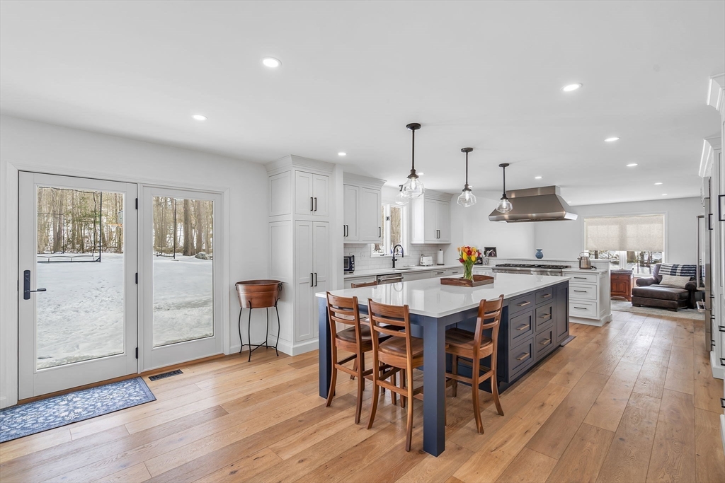 84 Jefferson Road Franklin, MA 02038 - Photo 11 of 39 a large kitchen with a table and chairs