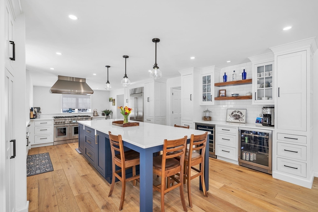 84 Jefferson Road Franklin, MA 02038 - Photo 12 of 39 a kitchen with stainless steel appliances a stove a sink dishwasher and a refrigerator with wooden floor