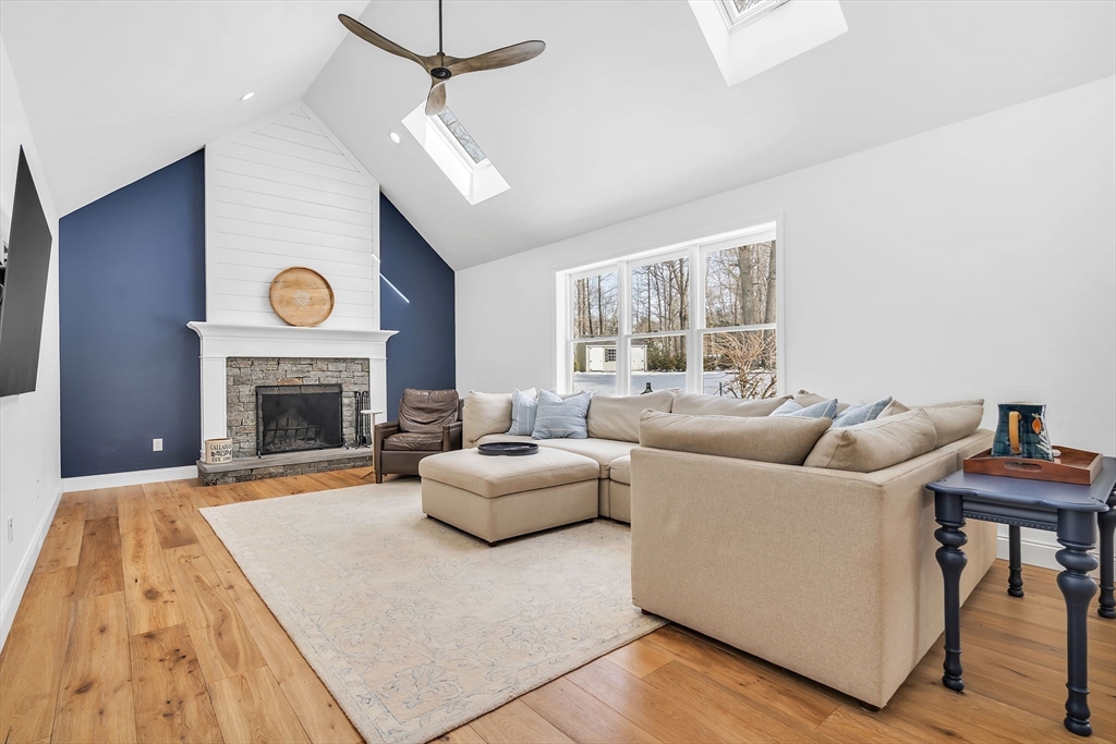 84 Jefferson Road Franklin, MA 02038 - Photo 16 of 39 a living room with furniture and a fireplace