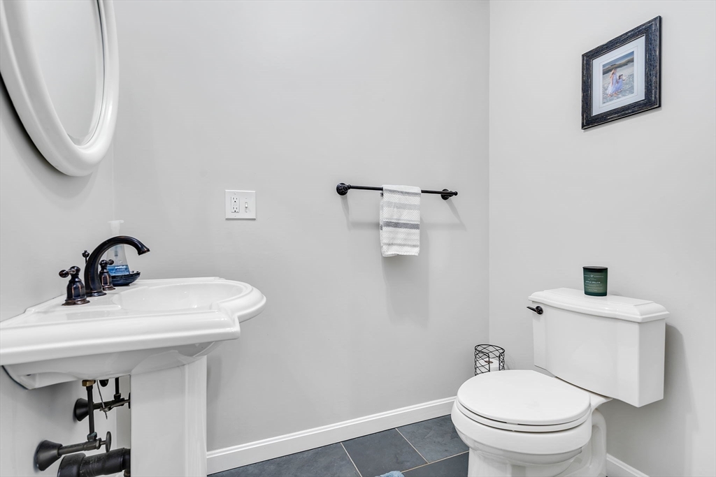 84 Jefferson Road Franklin, MA 02038 - Photo 19 of 39 a bathroom with a toilet sink and mirror