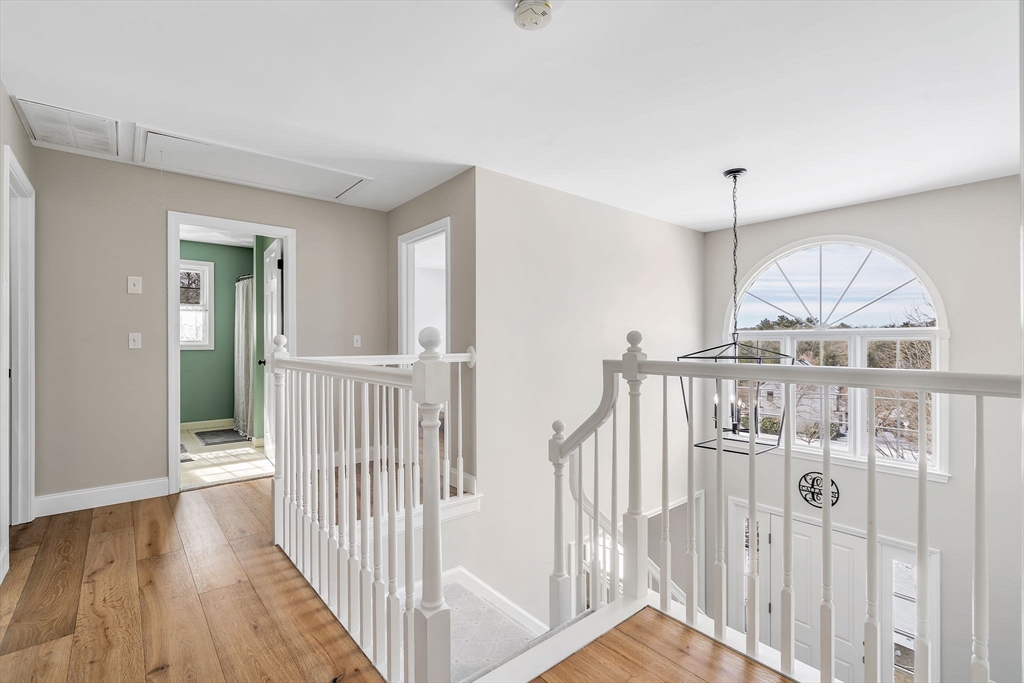 84 Jefferson Road Franklin, MA 02038 - Photo 20 of 39 a view of a hallway with a hardwood floor
