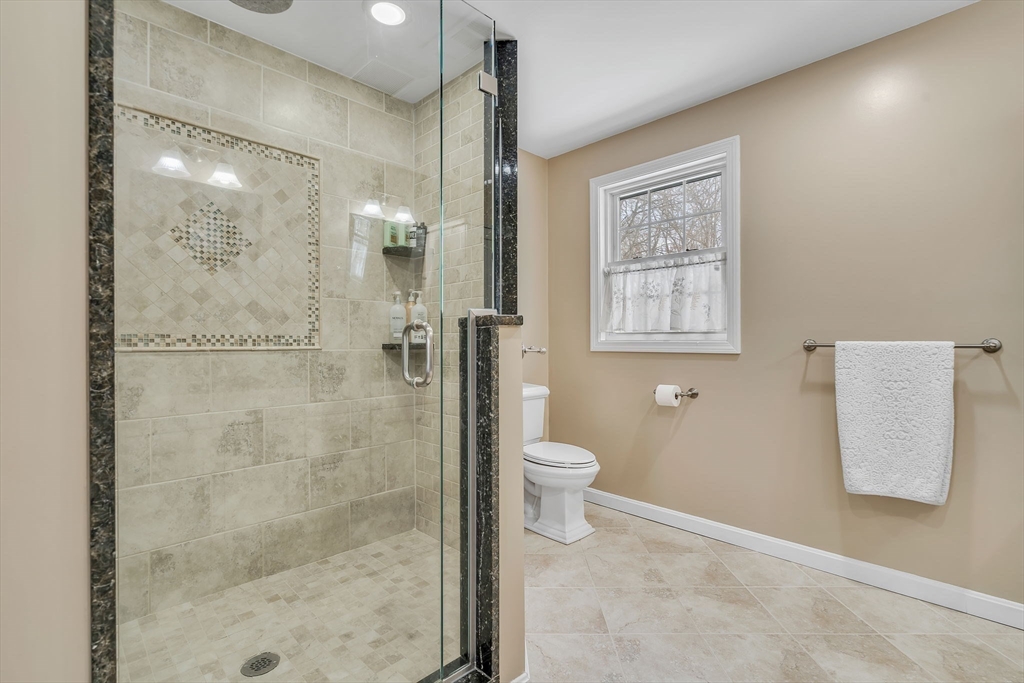 84 Jefferson Road Franklin, MA 02038 - Photo 24 of 39 a bathroom with a toilet sink and shower