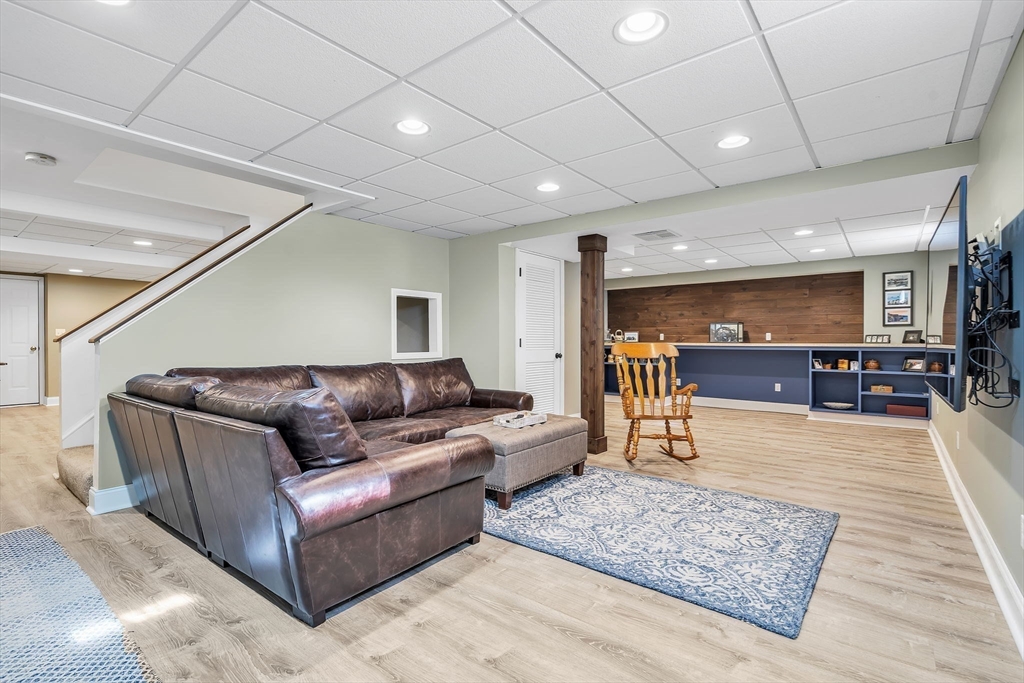 84 Jefferson Road Franklin, MA 02038 - Photo 31 of 39 a living room with furniture and a table