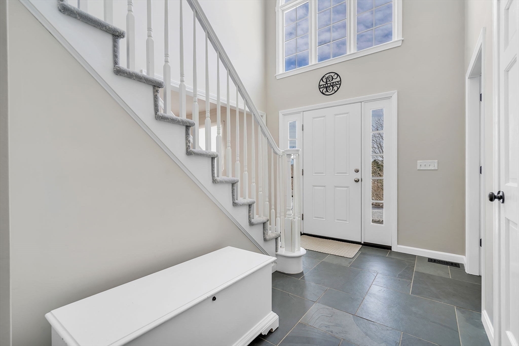 84 Jefferson Road Franklin, MA 02038 - Photo 4 of 39 a view of entryway and hall with wooden floor