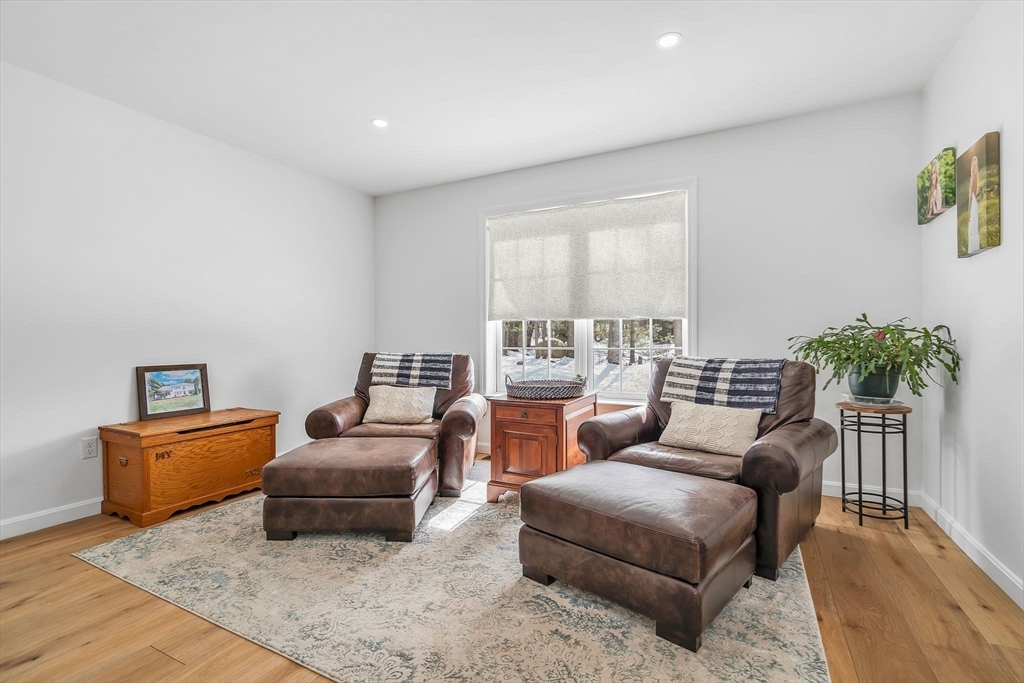 84 Jefferson Road Franklin, MA 02038 - Photo 9 of 39 a living room with furniture and a flat screen tv