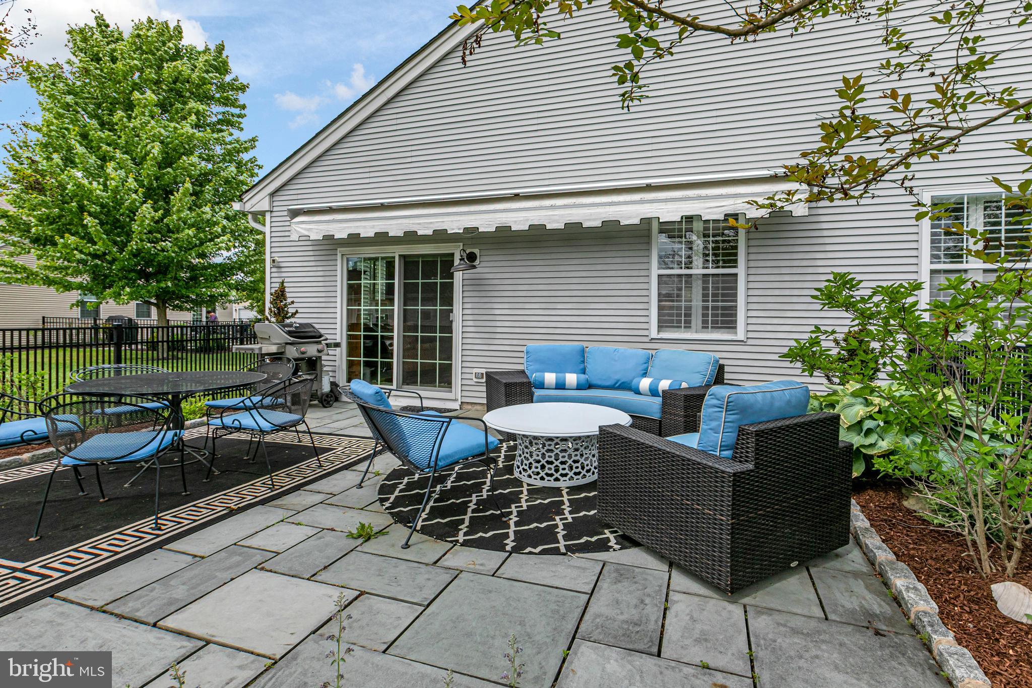 24 Foster Road Pennington, NJ 08534 - Photo 25 of 38 a view of a house with a backyard and sitting area