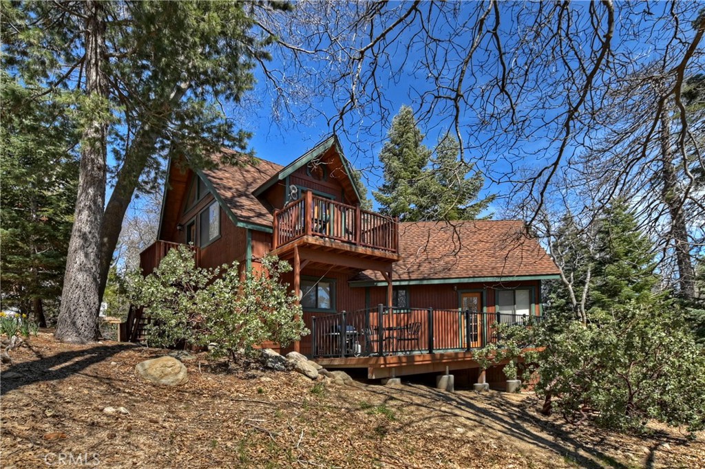 26285 Augusta Drive Lake Arrowhead, CA 92352 - Photo 16 of 47 a view of a big house with plants and large trees