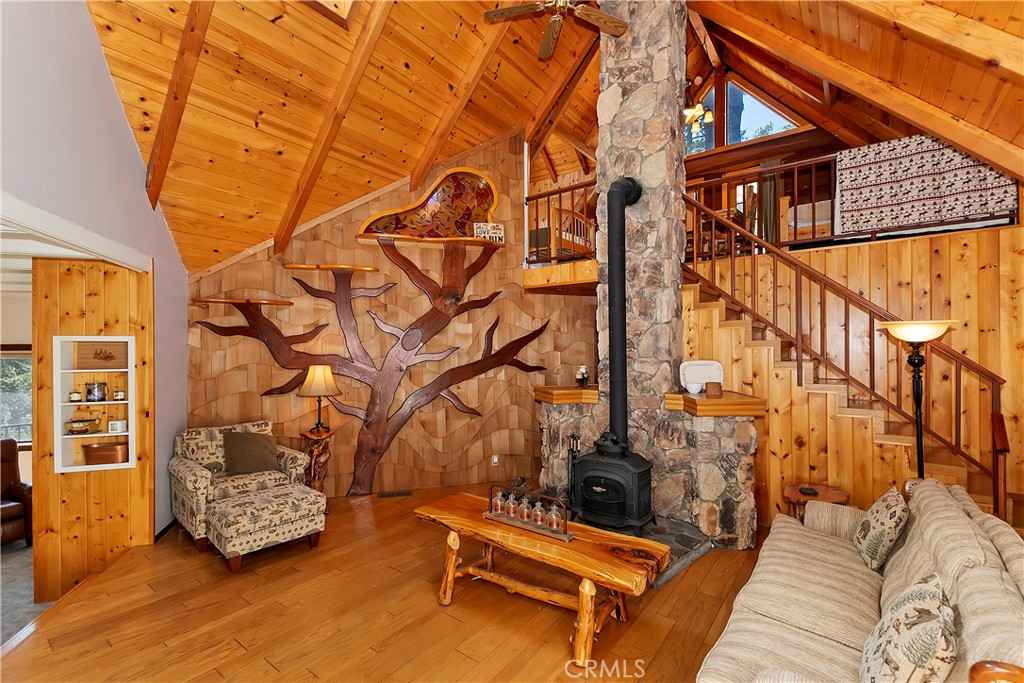 26285 Augusta Drive Lake Arrowhead, CA 92352 - Photo 2 of 47 a backyard of a house with wooden floor and outdoor seating