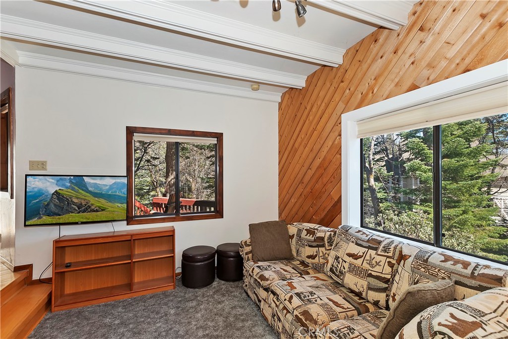 26285 Augusta Drive Lake Arrowhead, CA 92352 - Photo 22 of 47 a bedroom with a bed and wooden floor