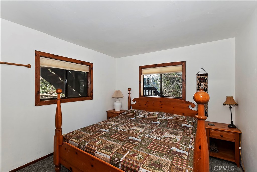 26285 Augusta Drive Lake Arrowhead, CA 92352 - Photo 26 of 47 a bedroom with a bed and a window
