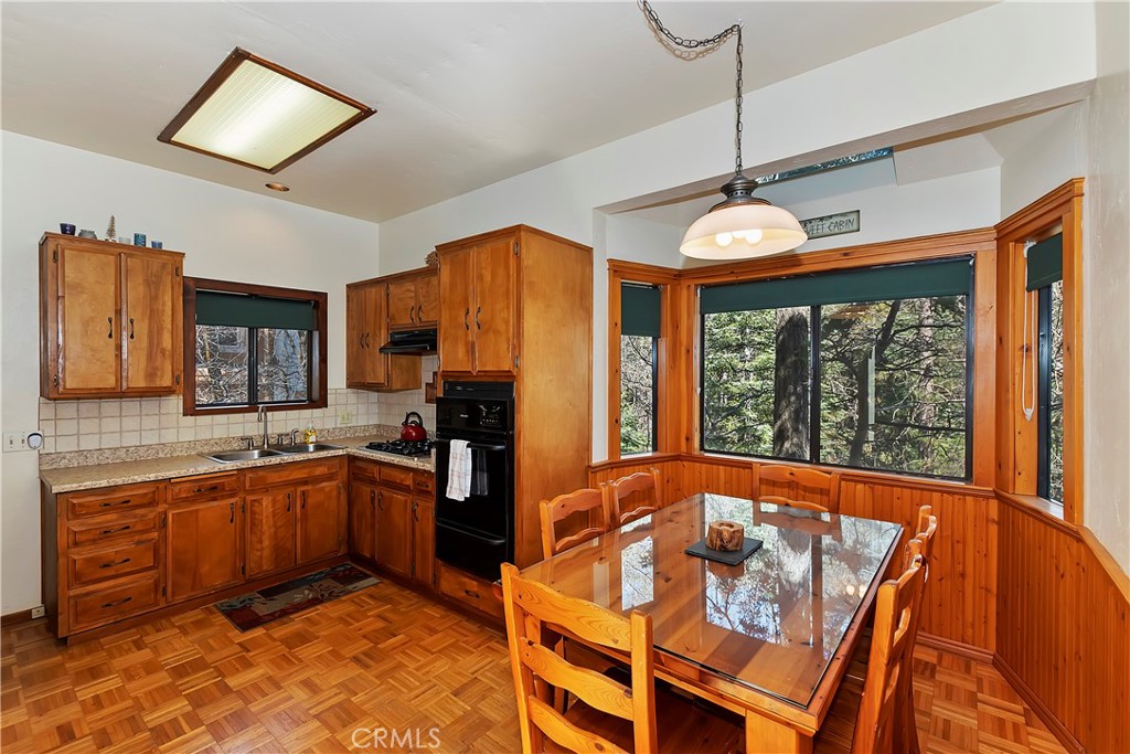 26285 Augusta Drive Lake Arrowhead, CA 92352 - Photo 28 of 47 a view of a kitchen with a sink and cabinets