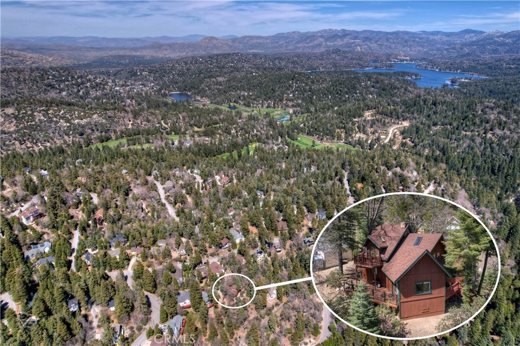 26285 Augusta Drive Lake Arrowhead, CA 92352 - Photo 5 of 47 an aerial view of a house with a yard and lake view