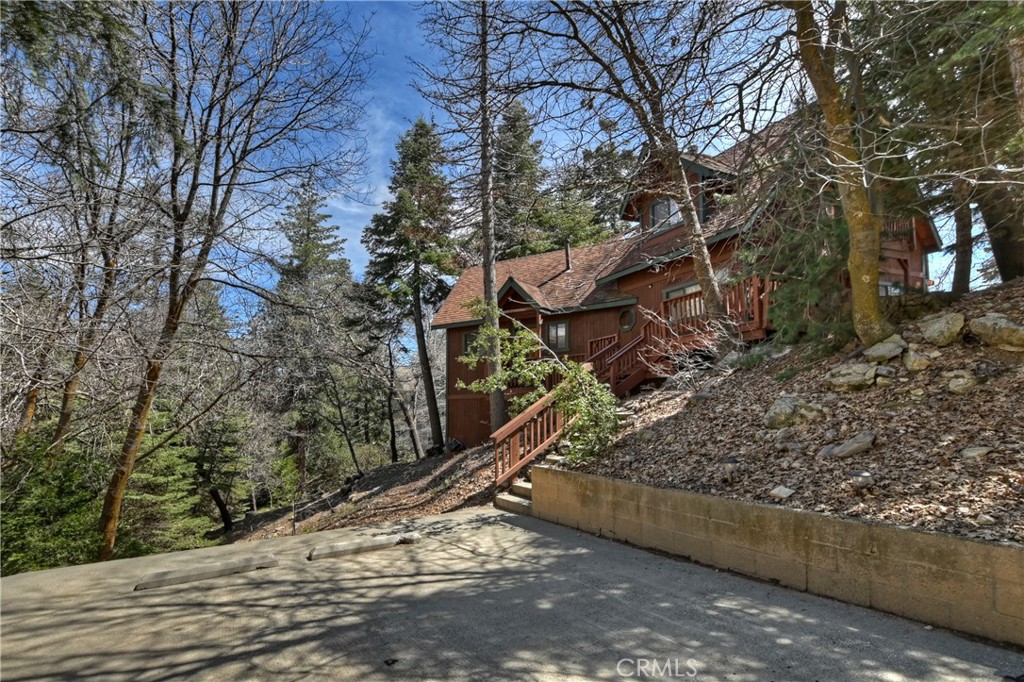 26285 Augusta Drive Lake Arrowhead, CA 92352 - Photo 8 of 47 a view of a wooden deck with trees