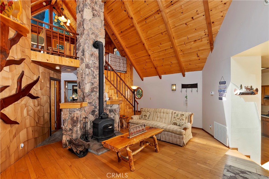 26285 Augusta Drive Lake Arrowhead, CA 92352 - Photo 10 of 47 a view of a patio with a table and chairs