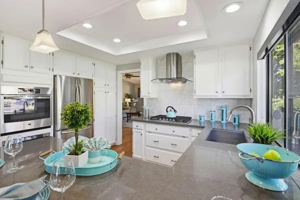 a kitchen with a sink stove and window