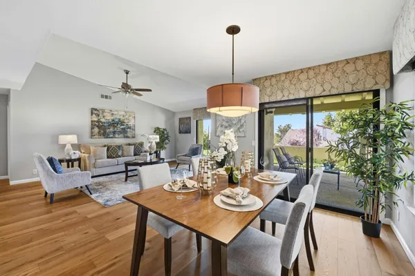a view of a dining room with furniture window and wooden floor