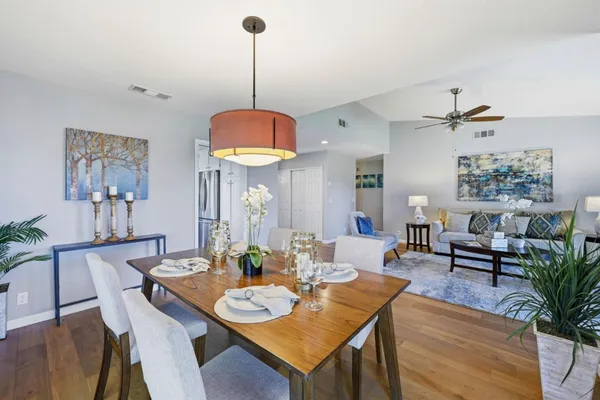 a view of a dining room with furniture window and wooden floor