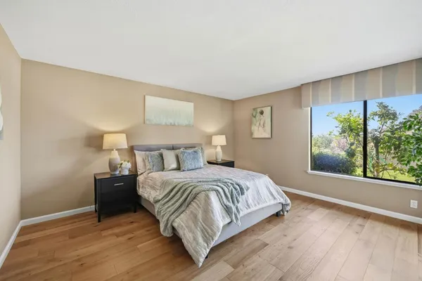 a bedroom with a bed and night stand