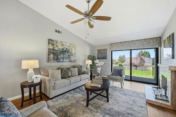 a living room with furniture and a fireplace