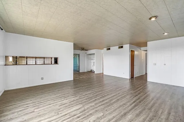 a kitchen with stainless steel appliances granite countertop a stove a refrigerator and a sink