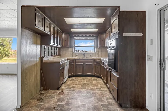 a view of a hallway with entryway door