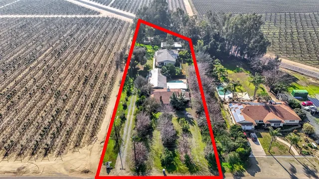 a aerial view of a house with a yard