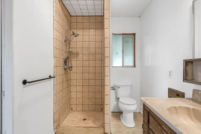 swimming pool view with a seating space