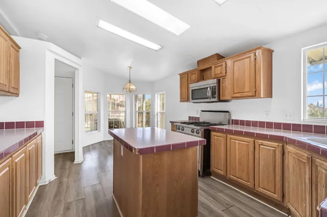 a view of an room with wooden floor and windows