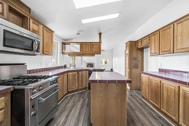 a bathroom with a double vanity sink mirror and bathtub