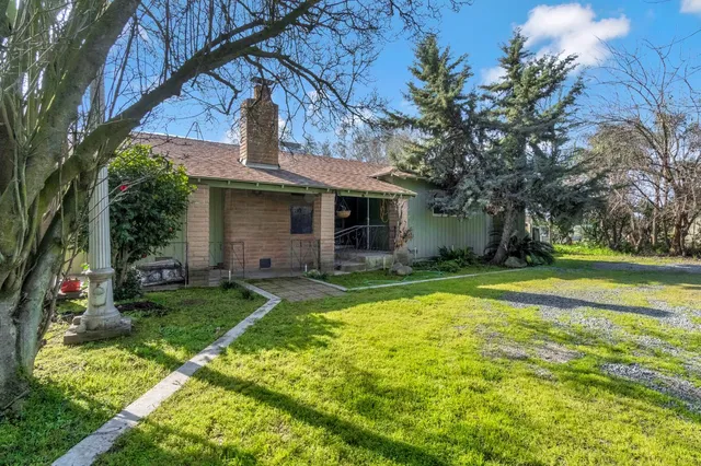 a view of a yard with an outdoor space