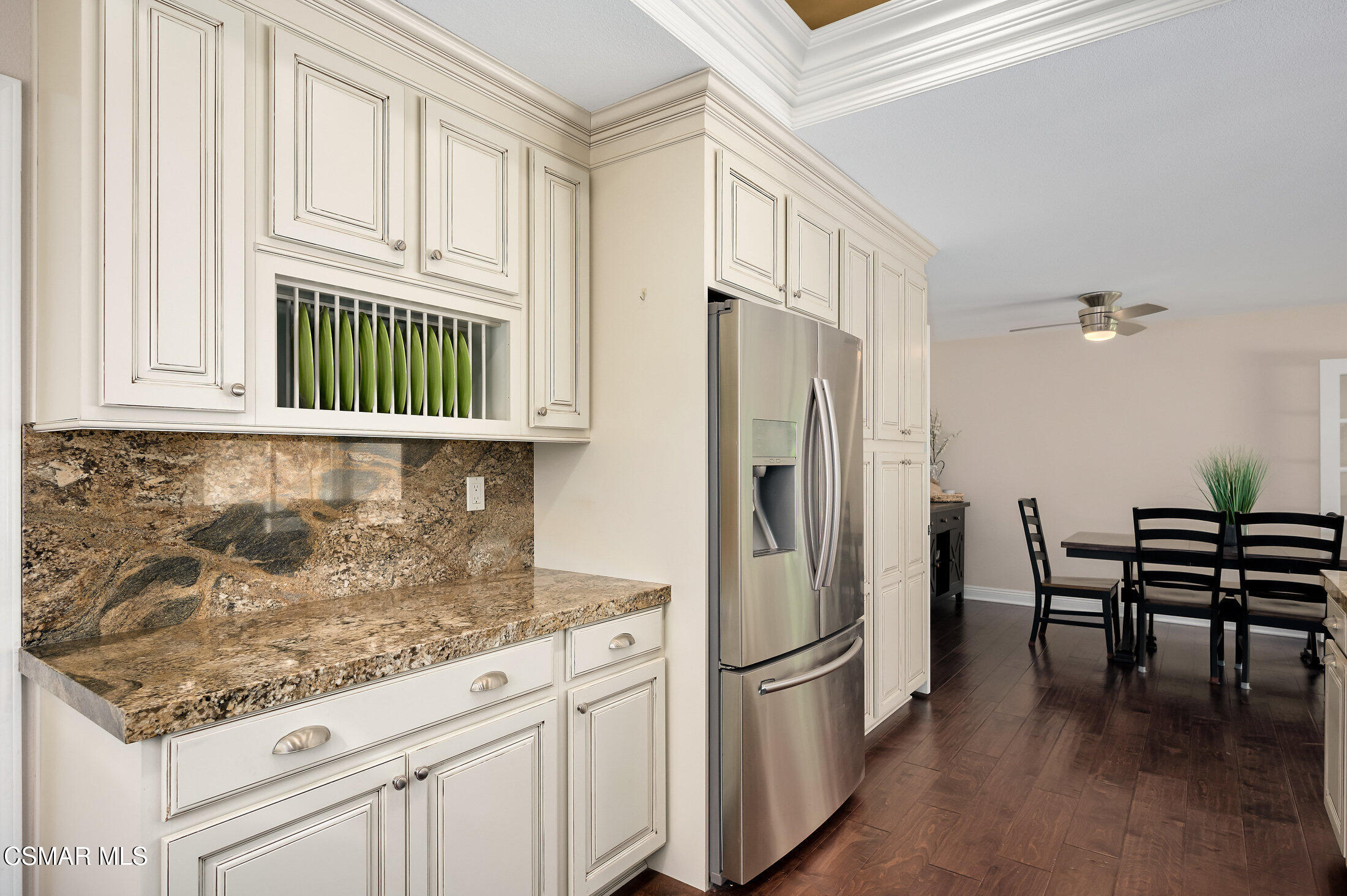 12142 Cherry Grove Street Moorpark, CA 93021 - Photo 12 of 36 a kitchen with stainless steel appliances granite countertop a refrigerator sink and cabinets