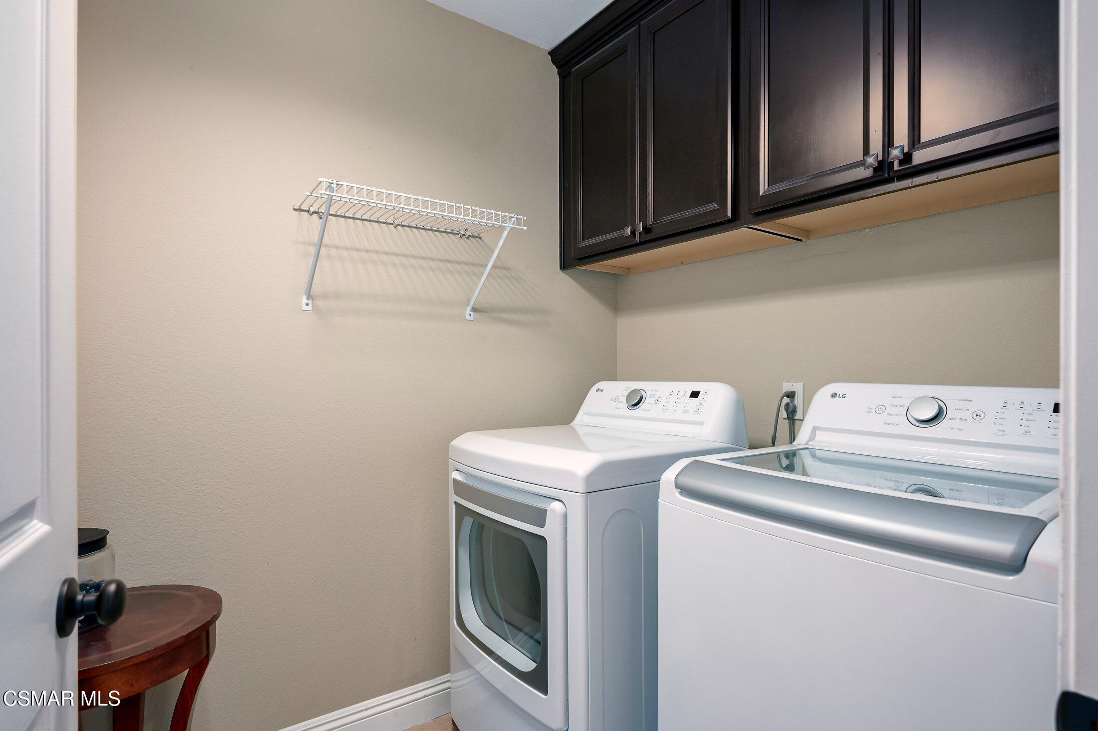 12142 Cherry Grove Street Moorpark, CA 93021 - Photo 17 of 36 a utility room with dryer and washer