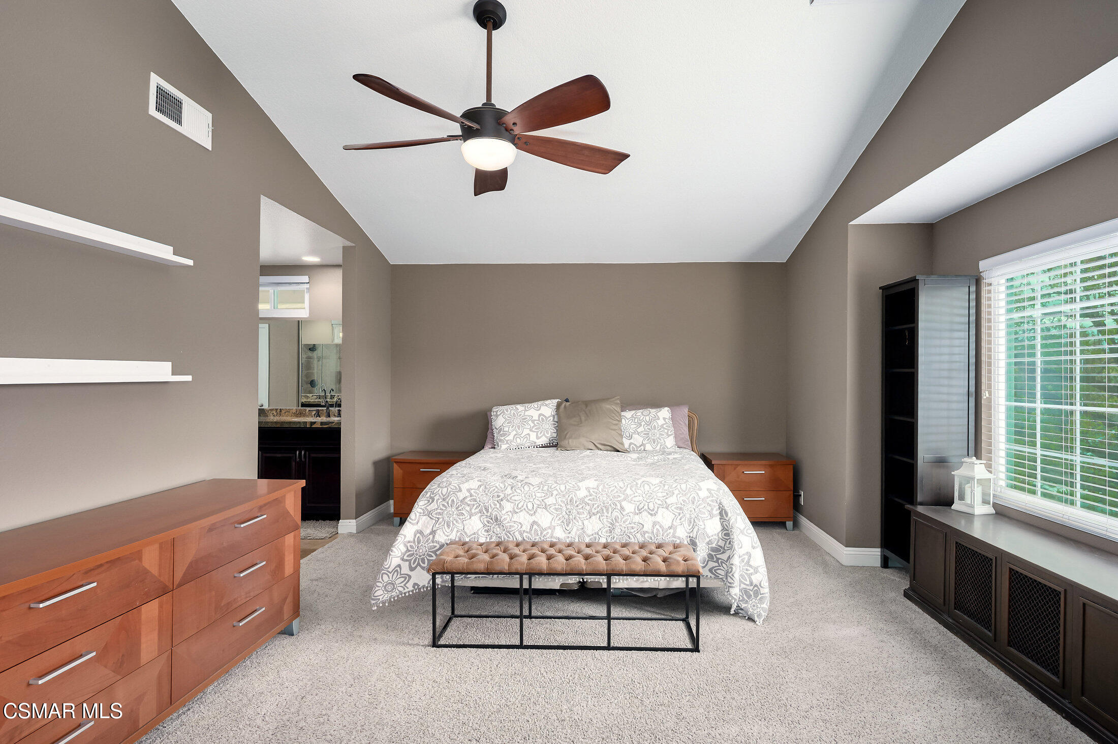 12142 Cherry Grove Street Moorpark, CA 93021 - Photo 20 of 36 a bedroom with a bed chandelier and a window