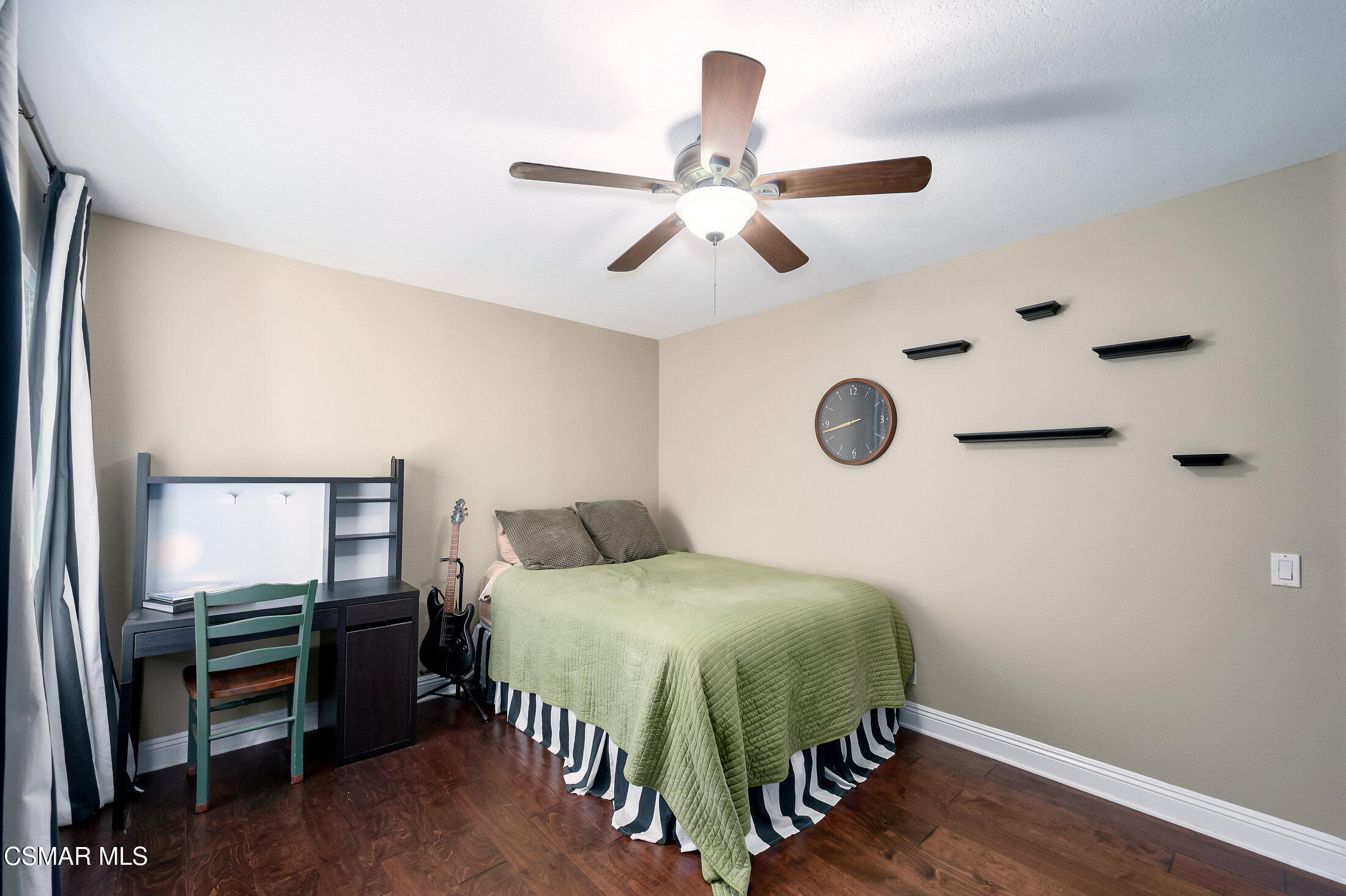 12142 Cherry Grove Street Moorpark, CA 93021 - Photo 24 of 36 a bedroom with a bed and a chandelier