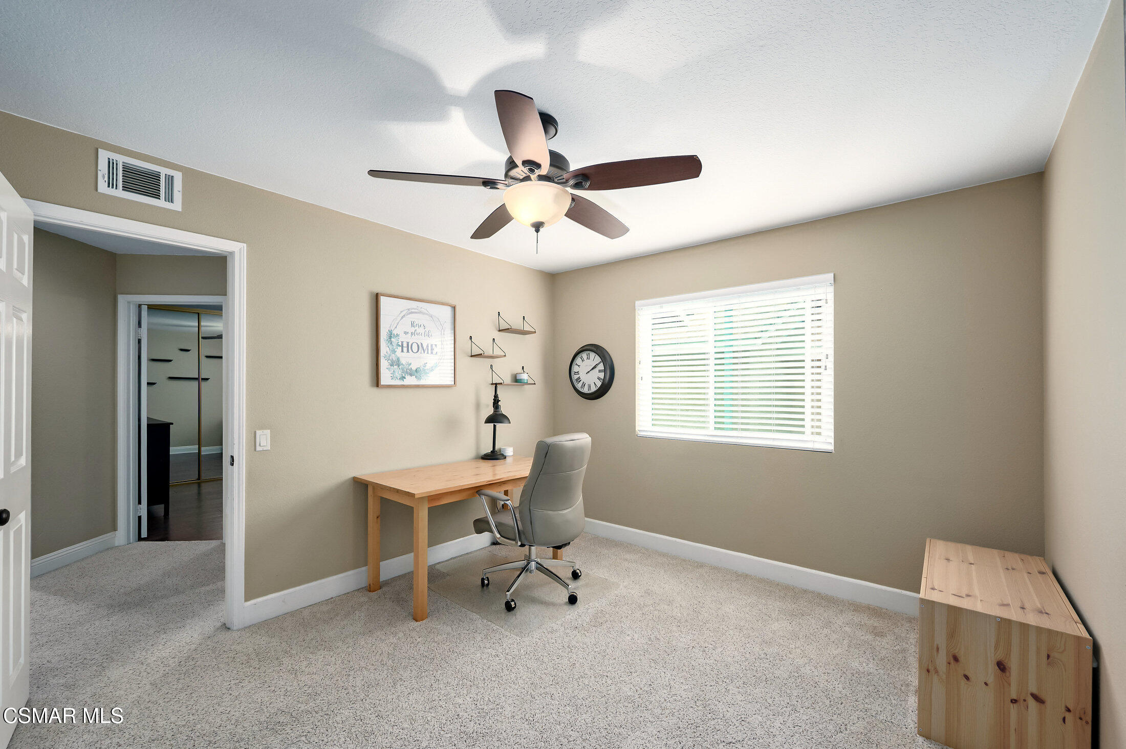 12142 Cherry Grove Street Moorpark, CA 93021 - Photo 27 of 36 a view of a workspace with furniture and a window