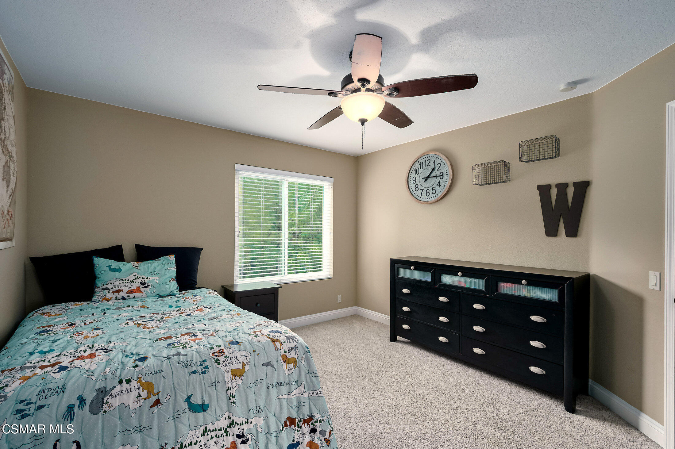 12142 Cherry Grove Street Moorpark, CA 93021 - Photo 29 of 36 a bedroom with a bed and a window