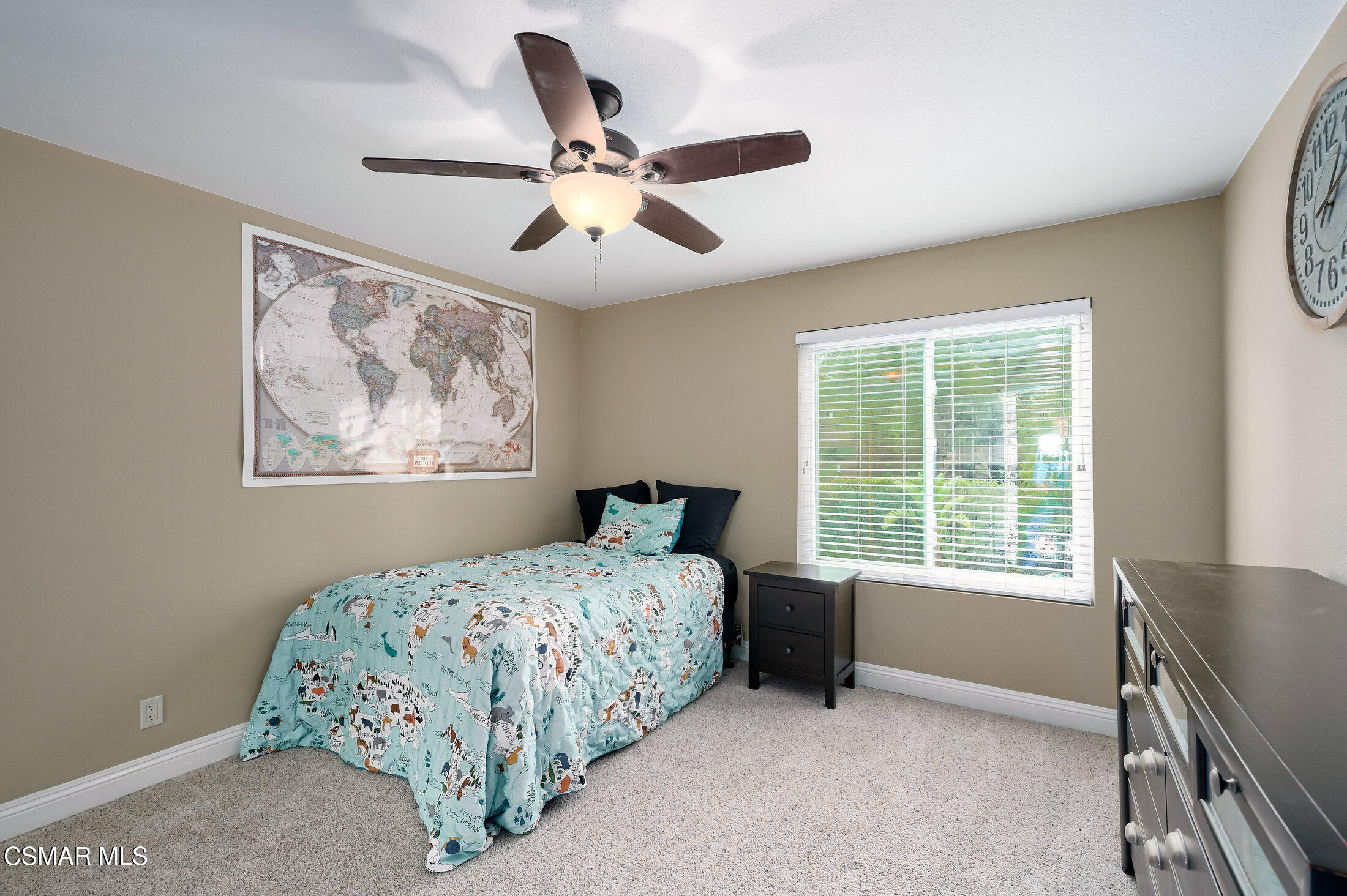 12142 Cherry Grove Street Moorpark, CA 93021 - Photo 30 of 36 a bedroom with a bed and a window