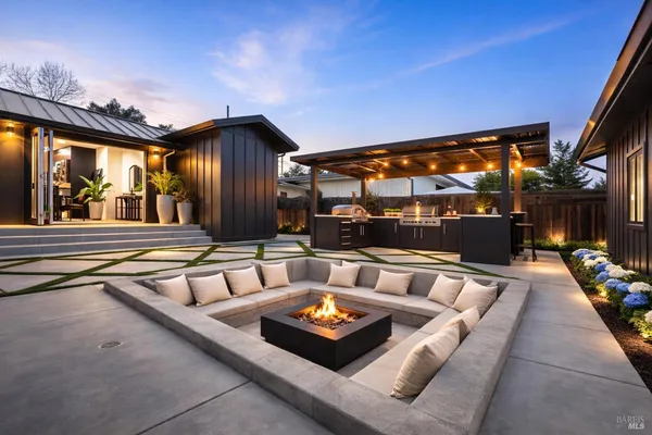 a outdoor living space with furniture and a fireplace