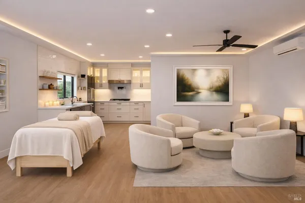 a bedroom with furniture and a flat screen tv