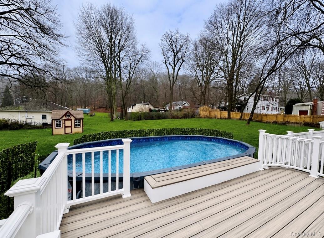 15 Pops Road Cortlandt Manor, NY 10567 - Photo 4 of 14 a view of a wooden deck and garden with wooden fence
