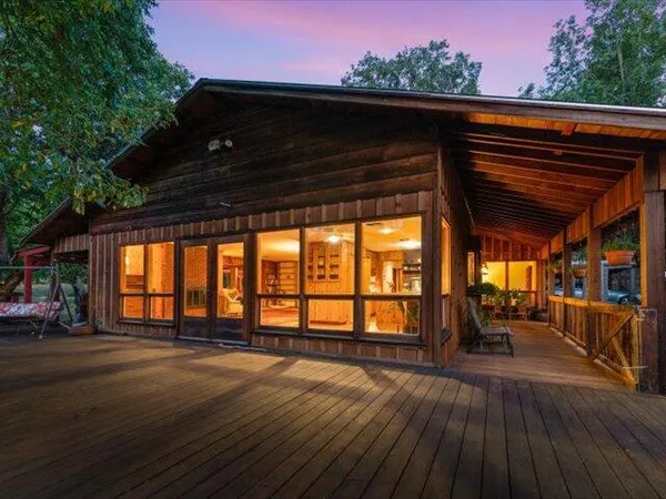 a front view of a house with wooden stairs