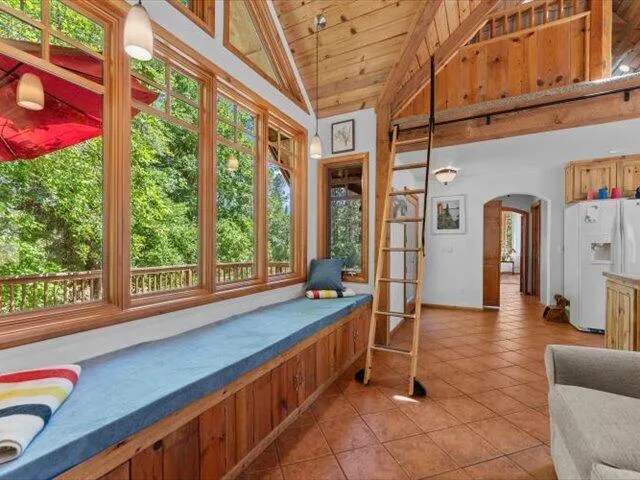 a view of a dining room with furniture window and outside view